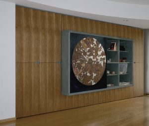 Large wedge-shaped cupboard in Italian walnut veneer, galvanized iron insert, artwork (Kaos) as sliding component.  All designed and made by Kutupé.